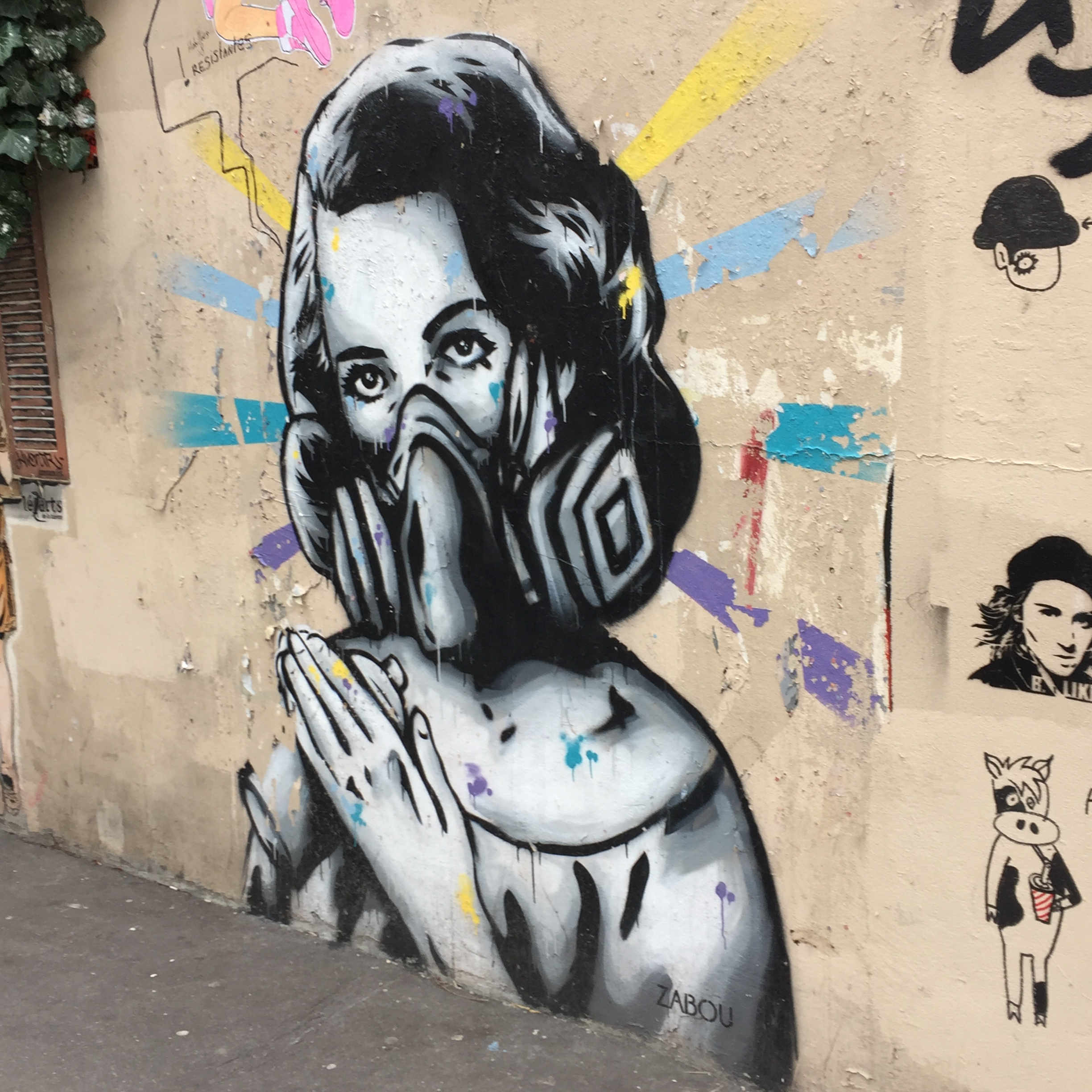 graffiti of virgin mary with a gasmask