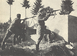 partisans pursuing behind a pillbox